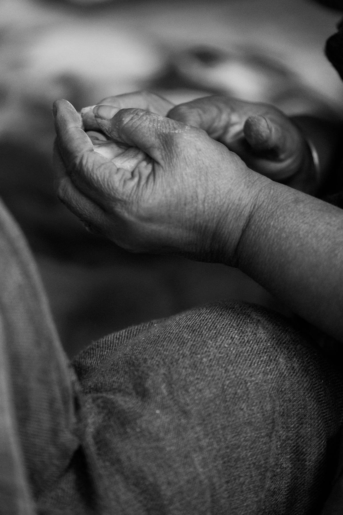 Hands resting together in a quiet moment