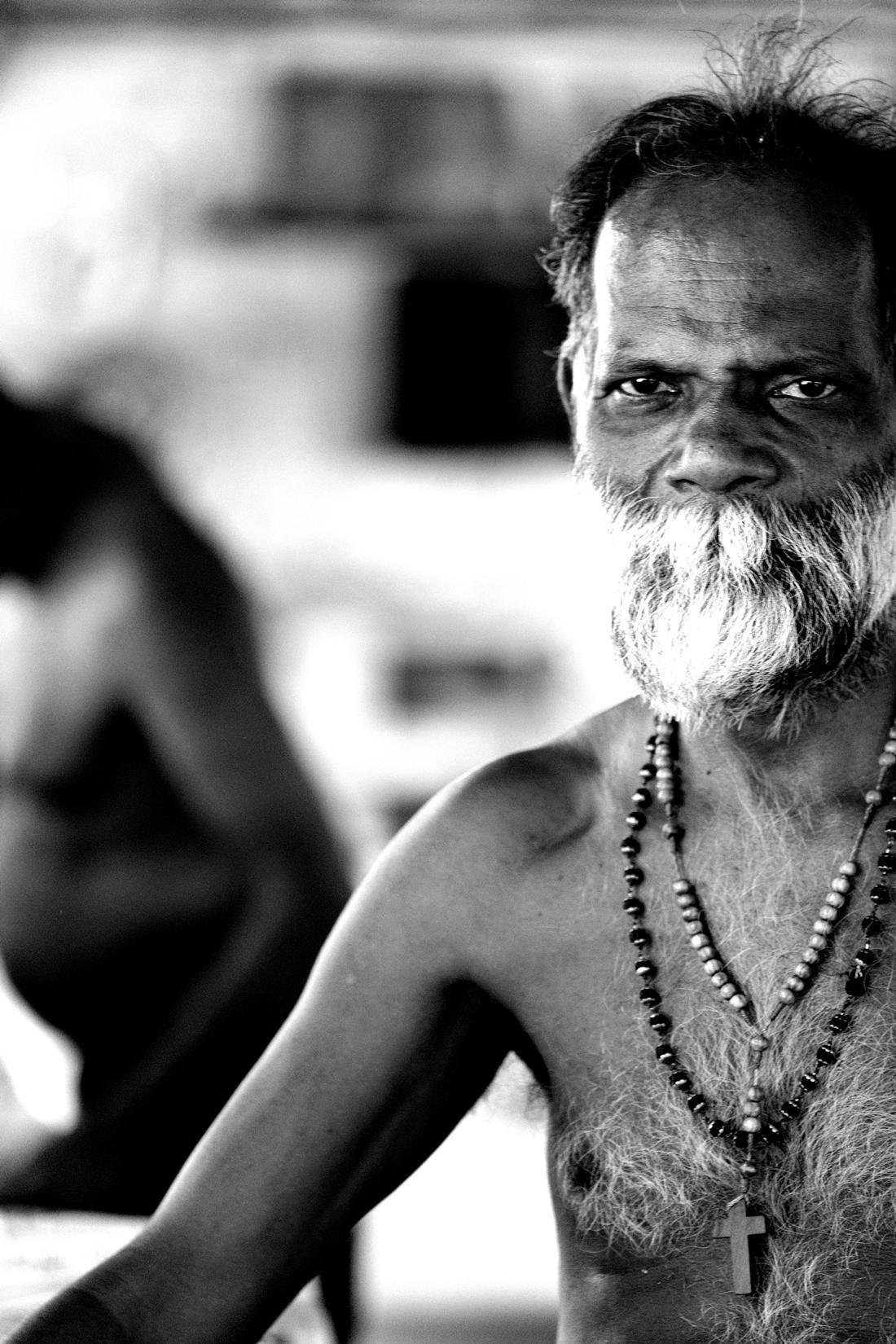 A woman looking up and smiling in India, photographed by documentary photographer Teresa Comito